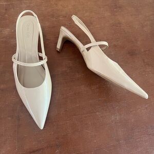 Neutral pointy toe Mary Jane style kitten heel pumps
New without tags